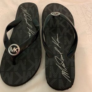Black Michael Kors flip-flops